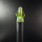 Green puffco pivot glass mouthpiece with with 2 horns and opal sittting in Puffco Pivot