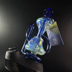 Blue recycler sitting on black puffco peak