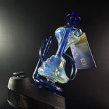 Blue recycler sitting on black puffco peak