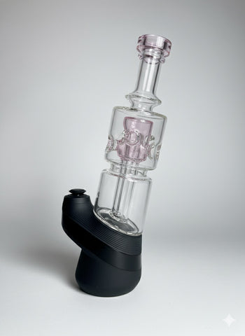 Pink puffco peak glass on a neutral backround