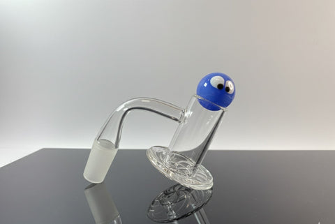 Quartz blender banger on a reflective surface and a neutral backround