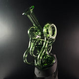 Green recycler puffco peak replacement glass sitting on a puffco peak