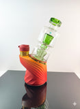 Green puffco peak glass sitting inside a puffco peak daybreak 