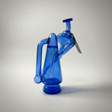 Puffco peak recycler on a grey backround - blue peak recycler