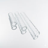 Three hollow etched pillars for a terp slurper on a neutral white backround 