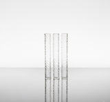 Three clear etched hollow pillars made for control towers or terp slurpers, on a white backround