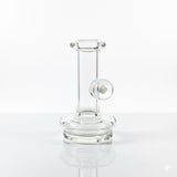 Clear puffco peak dry top replacement glass with an opal on a neutral white backround