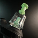 Geeen puffco peak glass fitting ontop of a black (onyx) Puffco Peak
