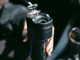 Canadian Man holding the Dr Dabber Switch Go electric E-Rig / Electric Dab Rig with a lifestyle  backround 
