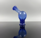 Blue canada made puffco pivot glass mouthpiece on a neutral backround