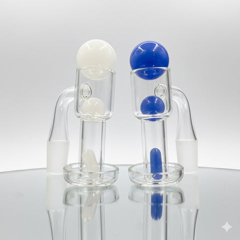 Two terp slurpers on a light backround, one with a white terp slurper set, one with a blue terp slurper set